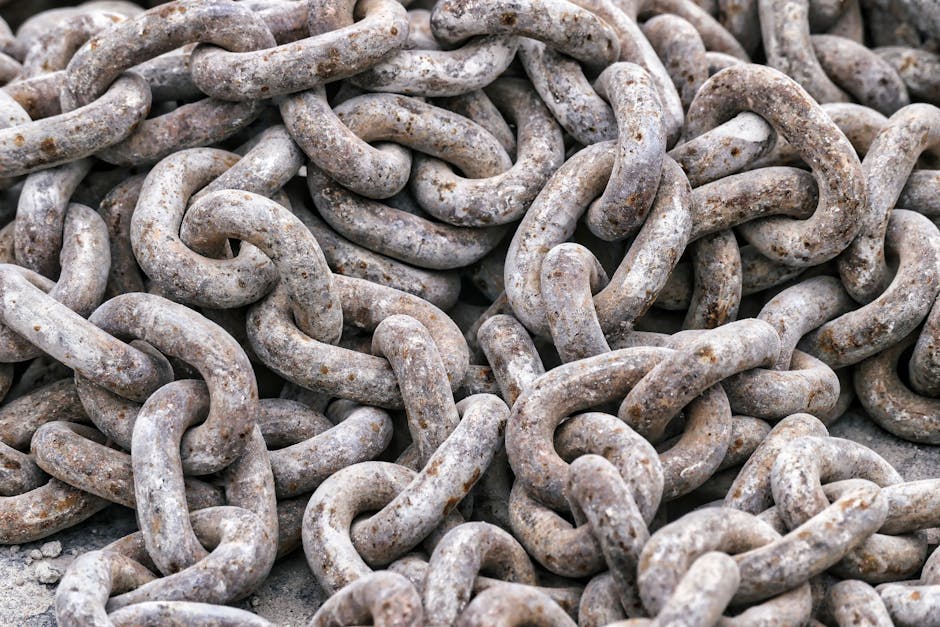 Detailed close-up of tangled rusty metal chains showing intricate texture.