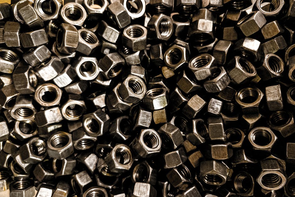 A detailed close-up of metal nuts, perfect for industrial design and hardware use.