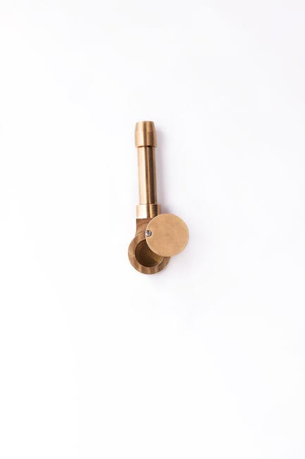 A vertical shot of an antique bronze pipe, perfect for studio and product photography.