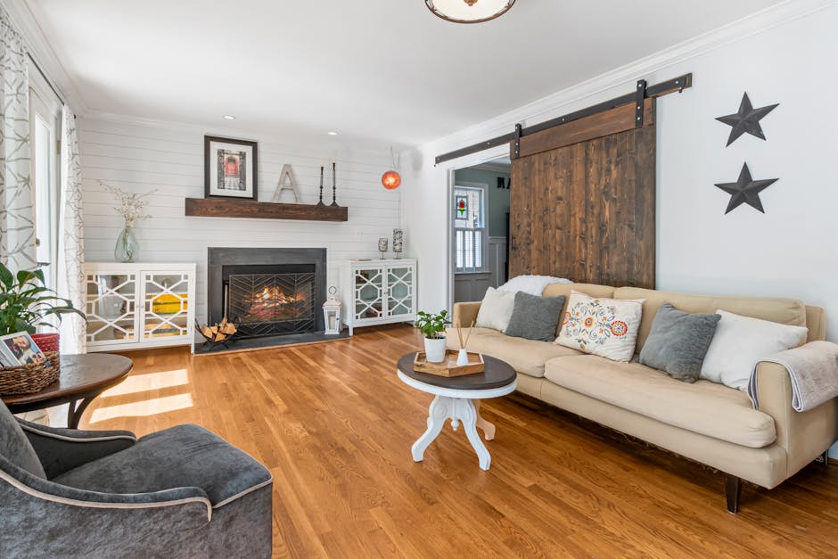 A bright and cozy modern farmhouse living room with fireplace and elegant decor.
